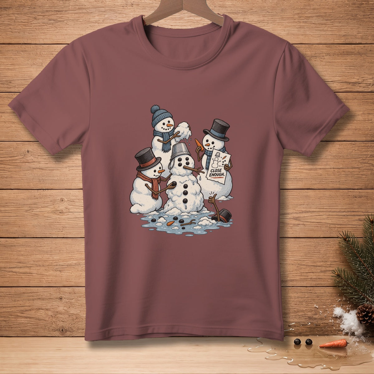 Three snowmen are built with a sign saying "Close Enough."