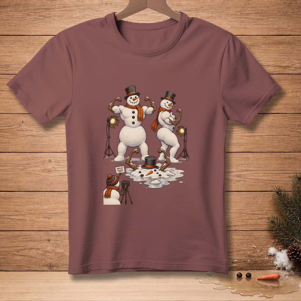 Two buff snowmen pose for a photographer snowman with a "Hold That" sign.