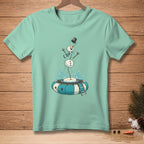 Mint t-shirt with illustration of a snowman falling into an inner tube with water splashing.