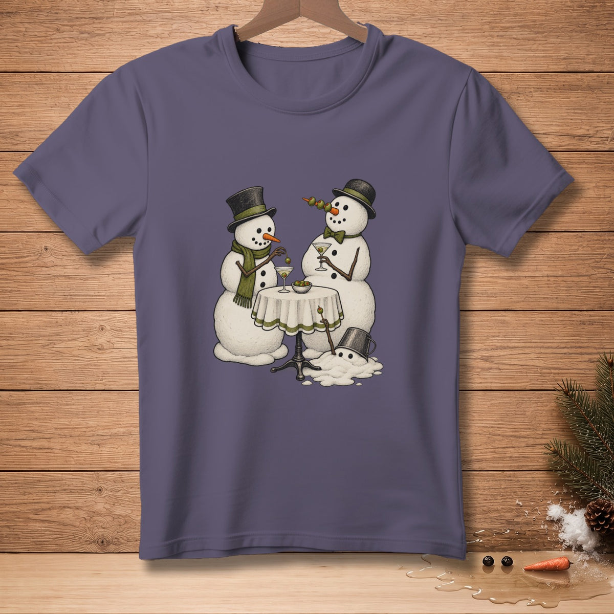 Two snowmen in hats and scarves enjoy martinis by a small table.