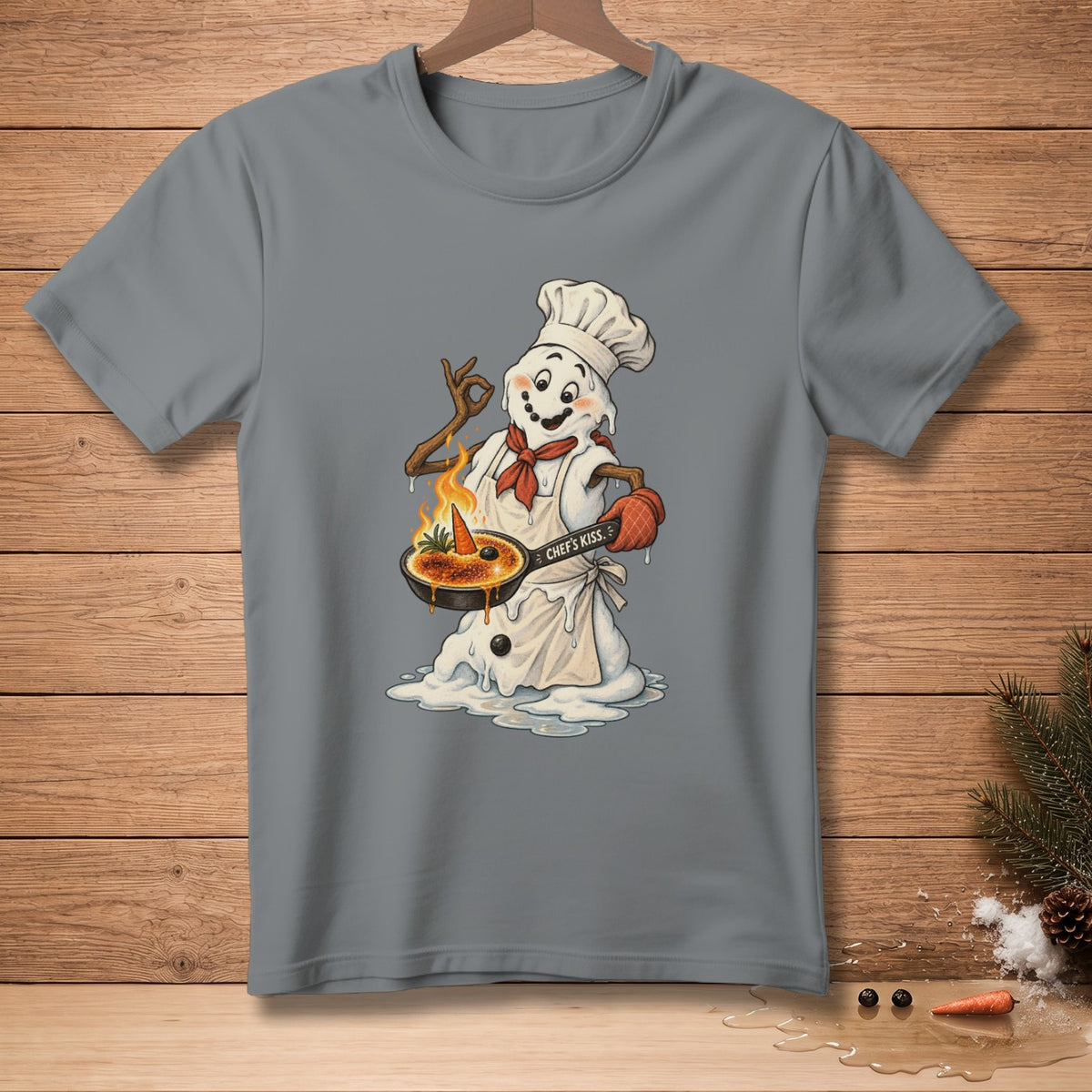 Snowman chef with carrot and crème brûlée, text "Chef's Kiss."
