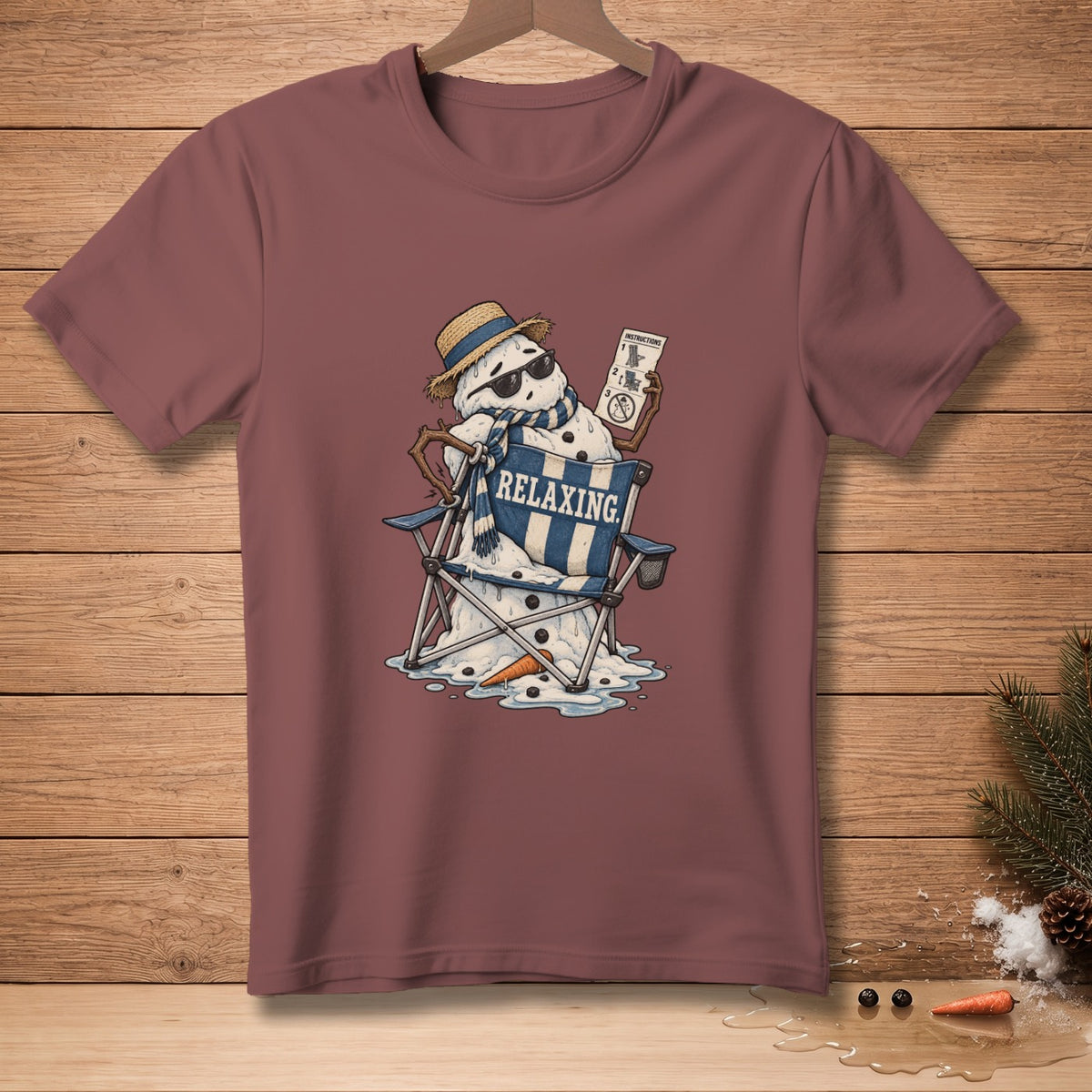 Snowman relaxing in a beach chair, wearing a hat, sunglasses, and scarf, holding instructions.