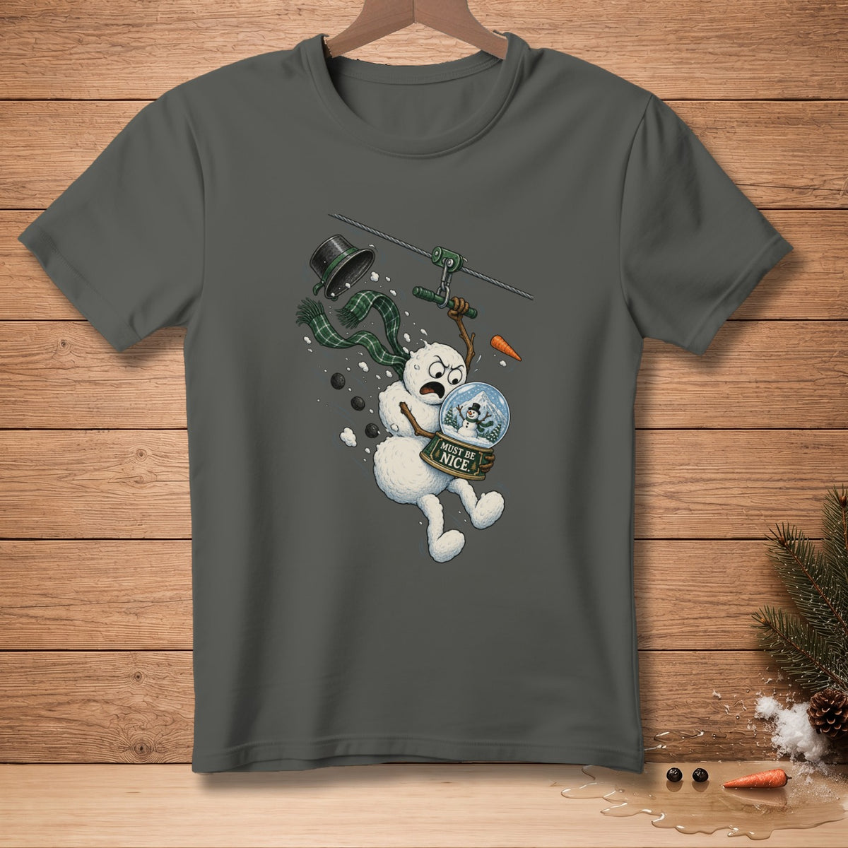 Snowman on zipline with snow globe that says "Must Be Nice."