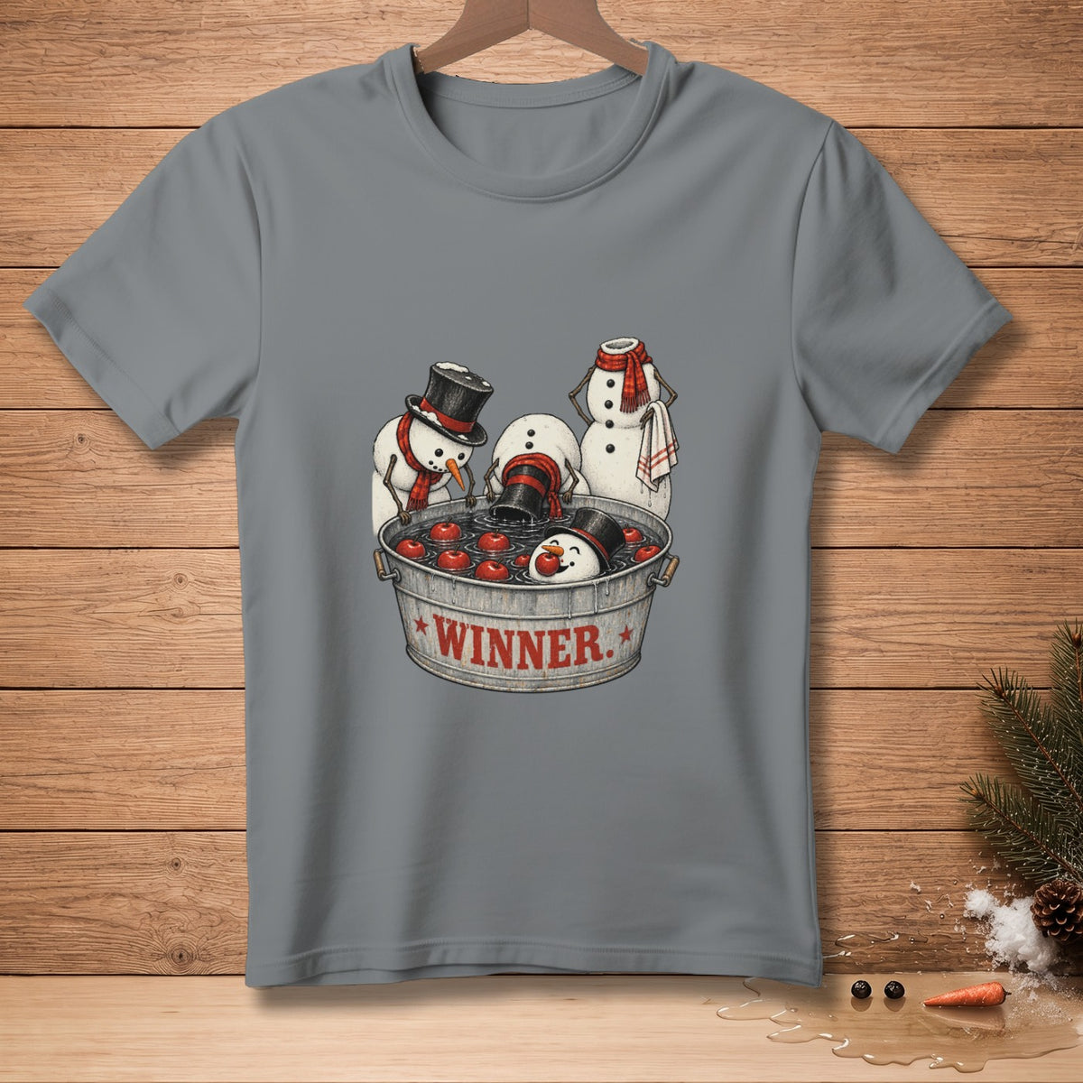 Snowmen bobbing for apples in a bucket labeled "WINNER."