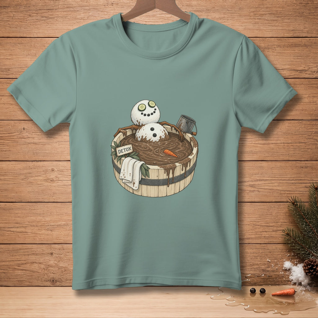 Snowman in a mud bath with cucumbers on eyes and "DETOX" sign.