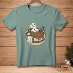 Snowman in a mud bath with cucumbers on eyes and "DETOX" sign.
