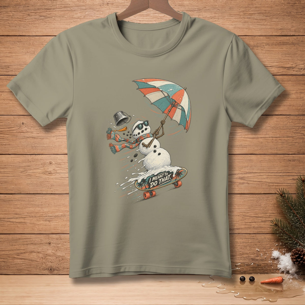 Snowman skateboarding with an umbrella and text that reads "I MEANT TO DO THAT."