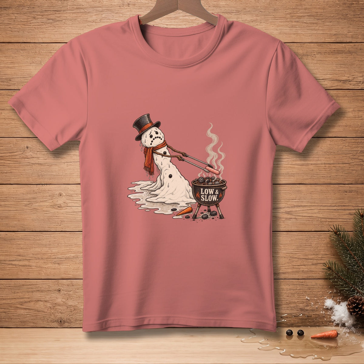 Melting snowman in top hat and scarf grilling hot dogs, text "LOW & SLOW".