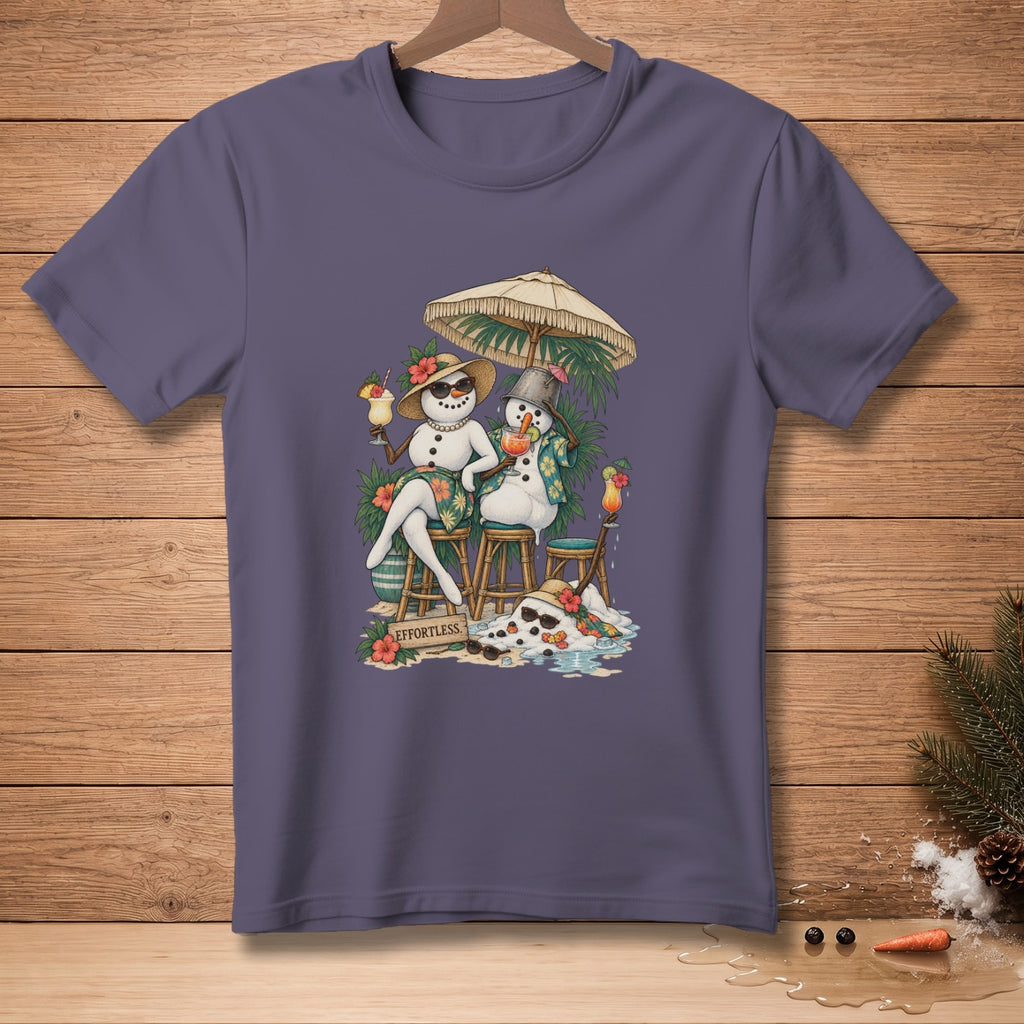 Two snowmen enjoy drinks under a beach umbrella, with "EFFORTLESS" written nearby.