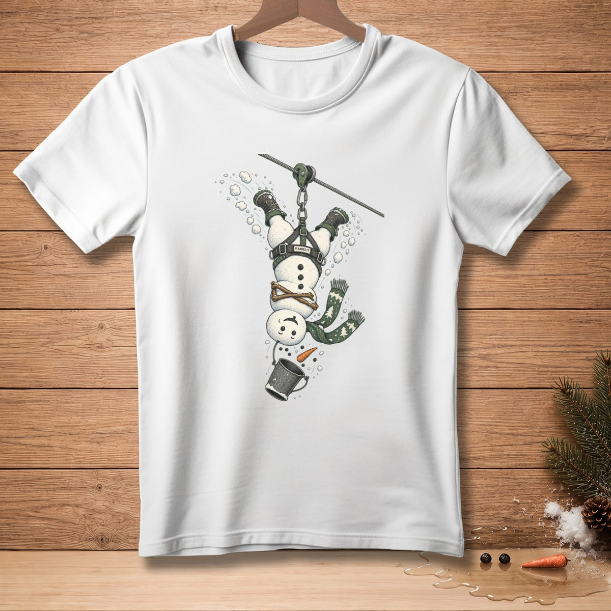 Snowman on a zip line with a bucket, "Planned It" text on harness.
