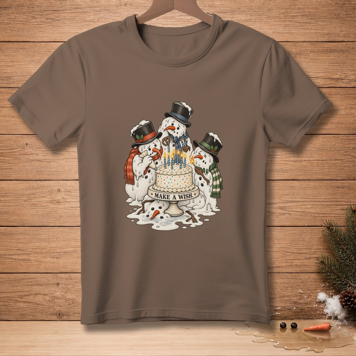 Three melting snowmen surround a birthday cake with lit candles, reading "MAKE A WISH".