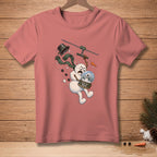 Pink t-shirt with illustration of a panicked snowman ziplining with a snow globe.