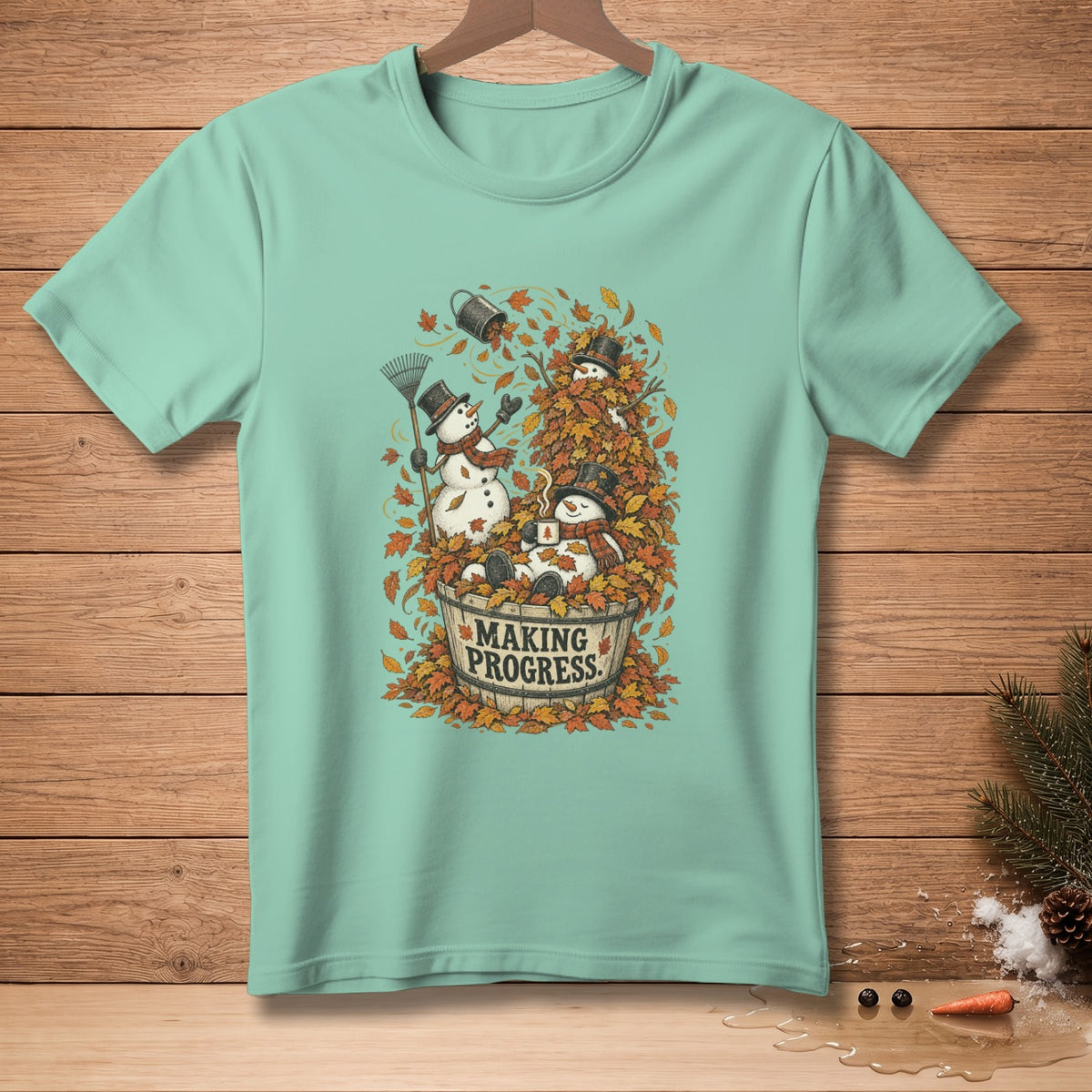 Snowmen in a barrel of leaves with text "MAKING PROGRESS"