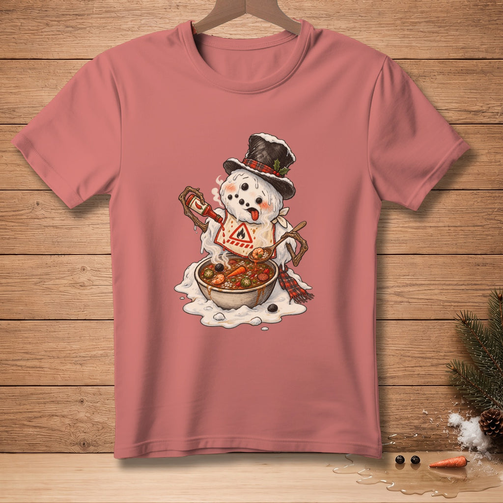 Snowman with hat and scarf adding hot sauce to a bowl of stew on a t-shirt.