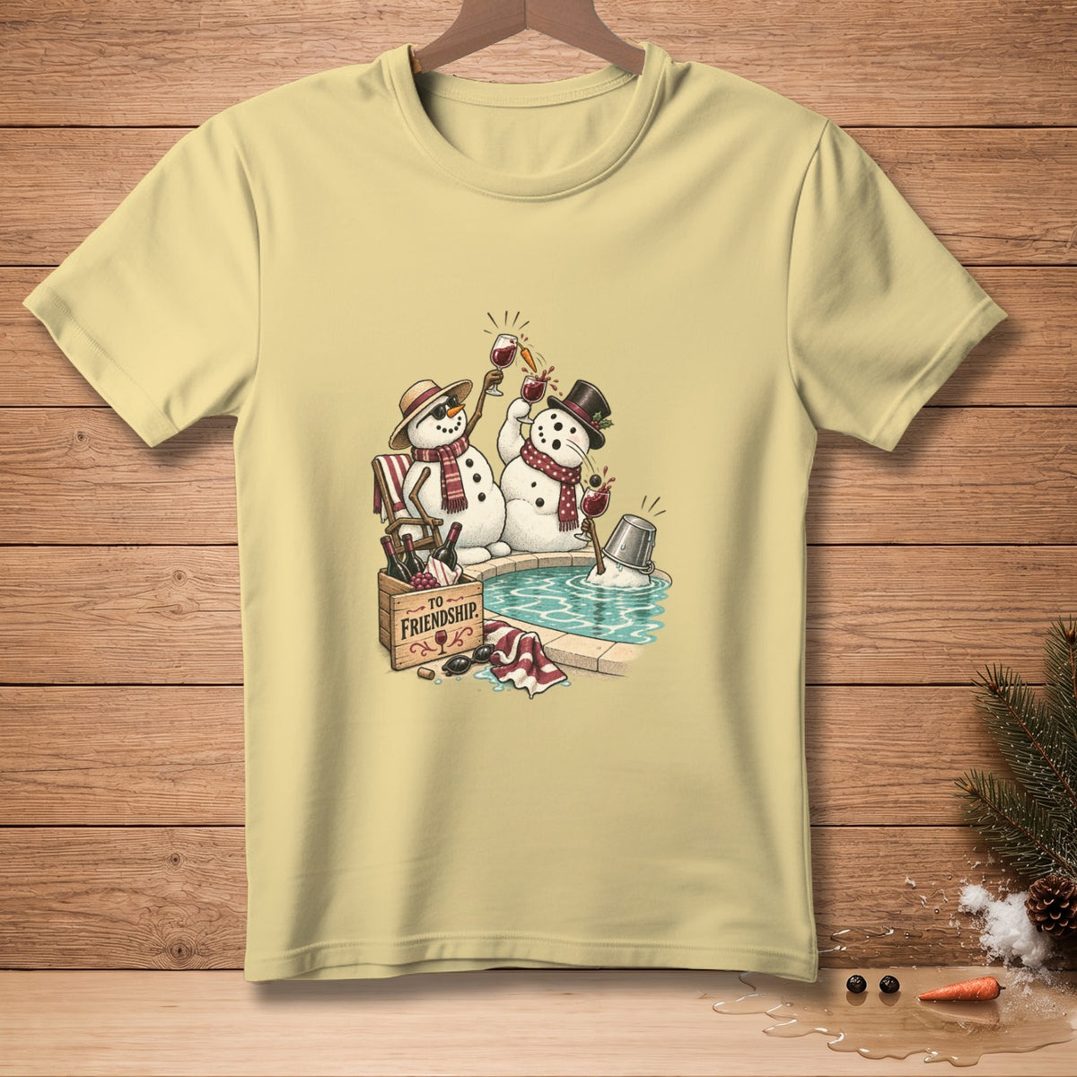 Two snowmen toast with wine glasses in a pool, a wooden crate reads "To Friendship".