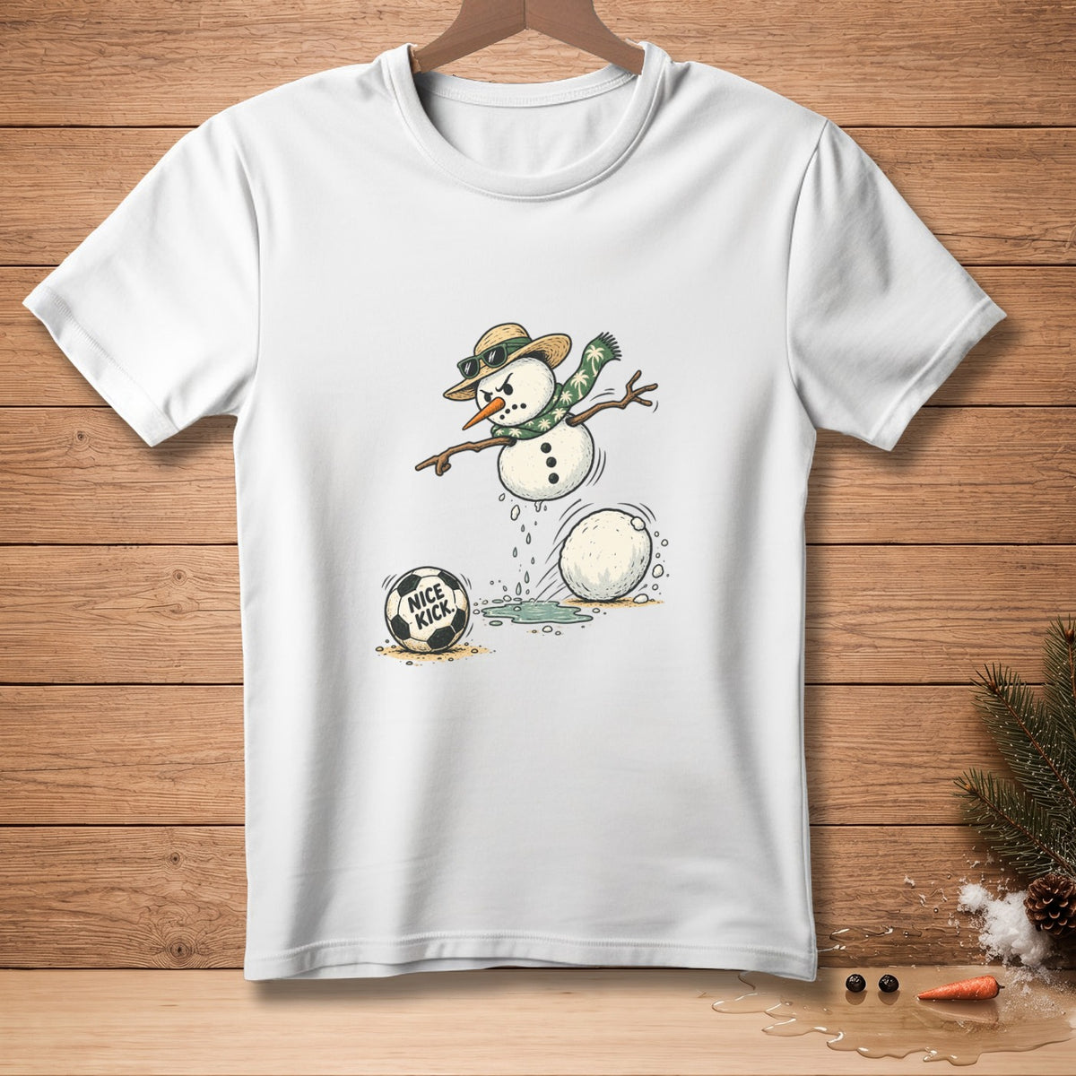 White t-shirt featuring a cartoon snowman playing soccer, with text "NICE KICK".