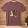 Melting snowman and Bigfoot sitting on a bench, eating melting ice cream cones.