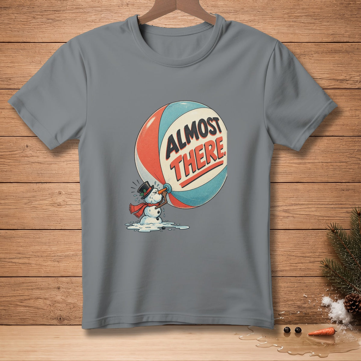 Melting snowman pushing a large ball with text "ALMOST THERE".