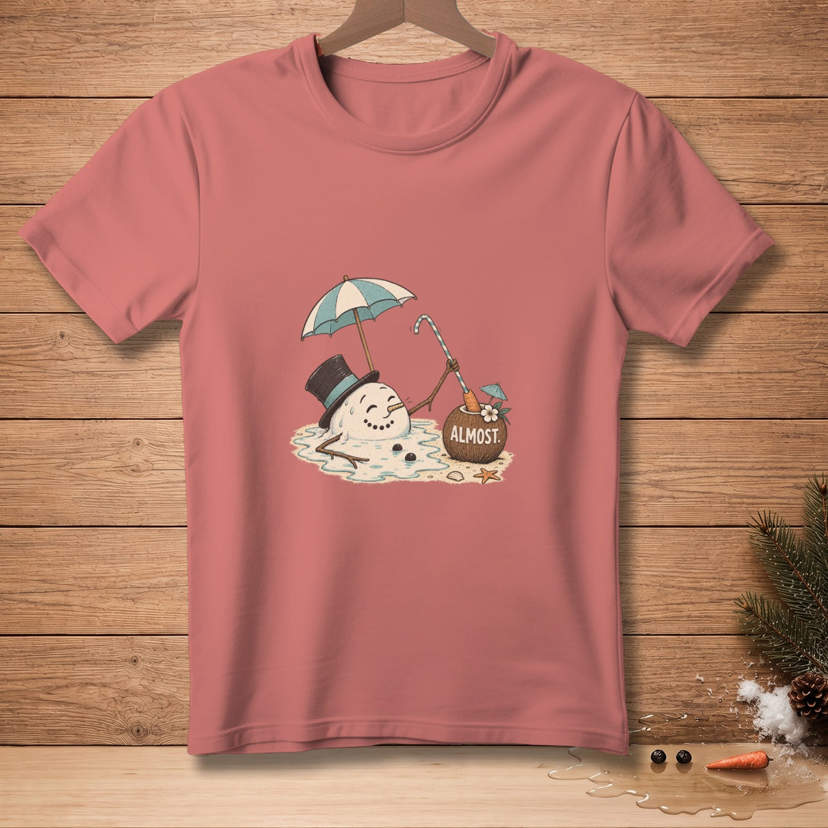 T-shirt with melting snowman holding umbrella, candy cane, and coconut drink labeled "ALMOST."