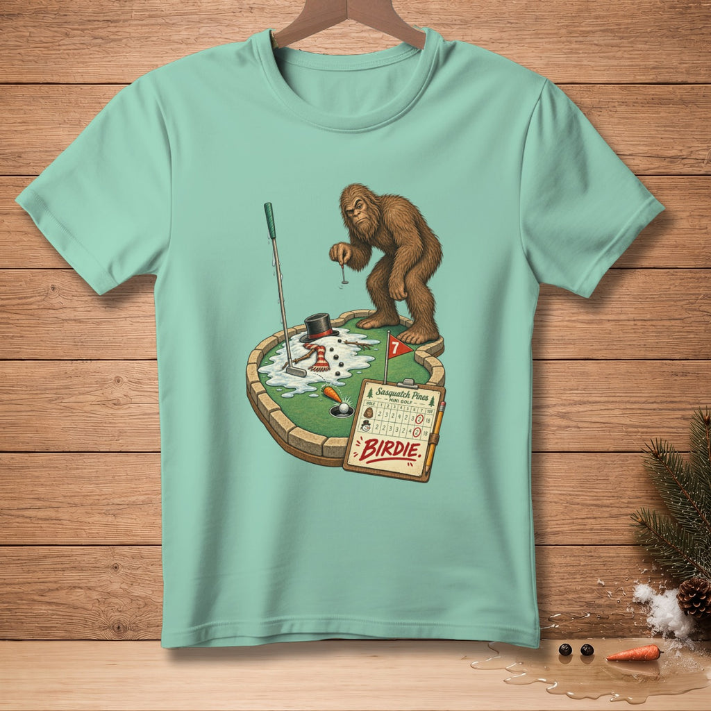 Bigfoot plays mini golf with a snowman and a scorecard that says "Birdie".