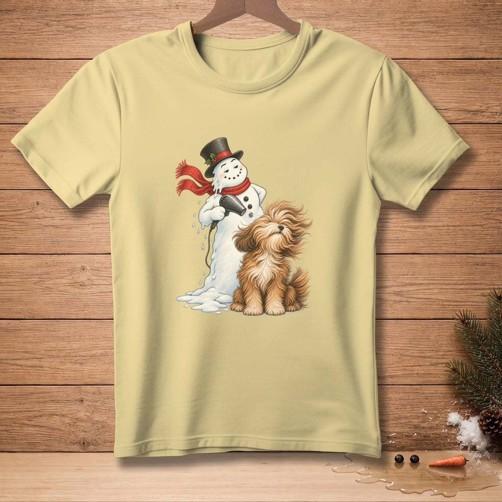 Snowman drying a fluffy brown dog with a red scarf and black hat.