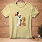 Snowman drying a fluffy brown dog with a red scarf and black hat.