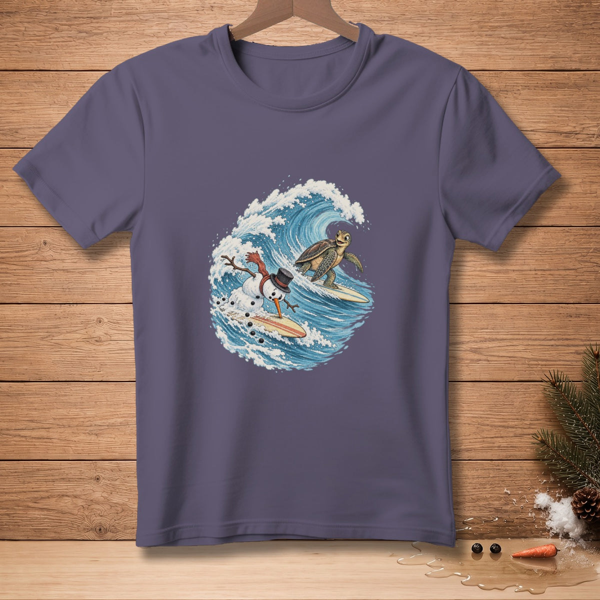 Snowman and turtle surfing on waves, cartoon graphic on purple t-shirt.
