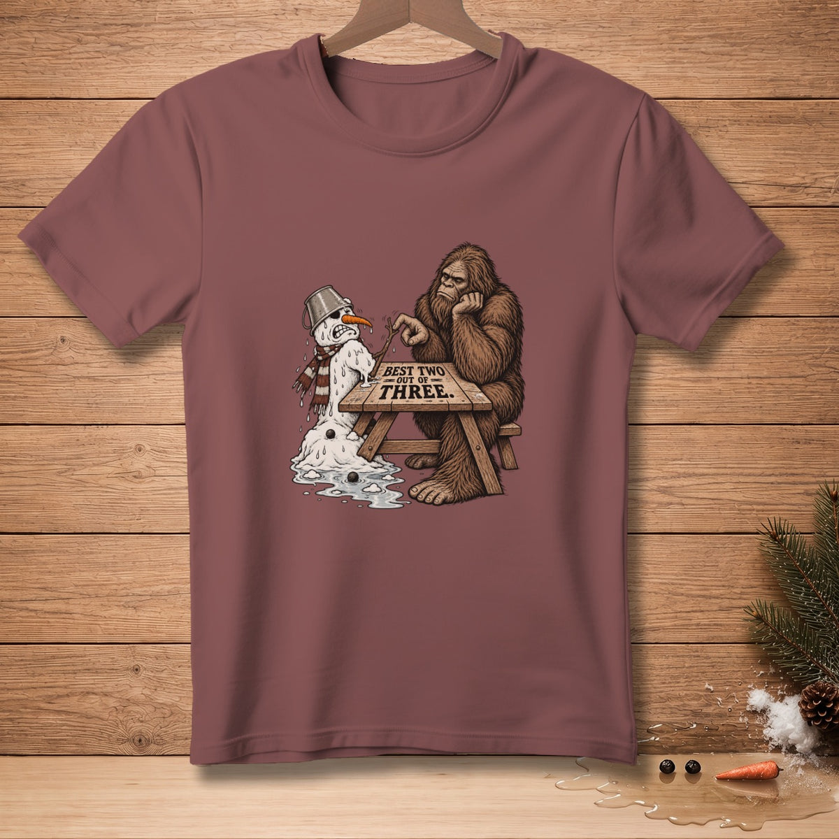 Bigfoot playing a board game with a melting snowman that reads "Best two out of three."