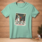 T-shirt with illustration of melting snowmen and parrot, text "USE THIS ONE."