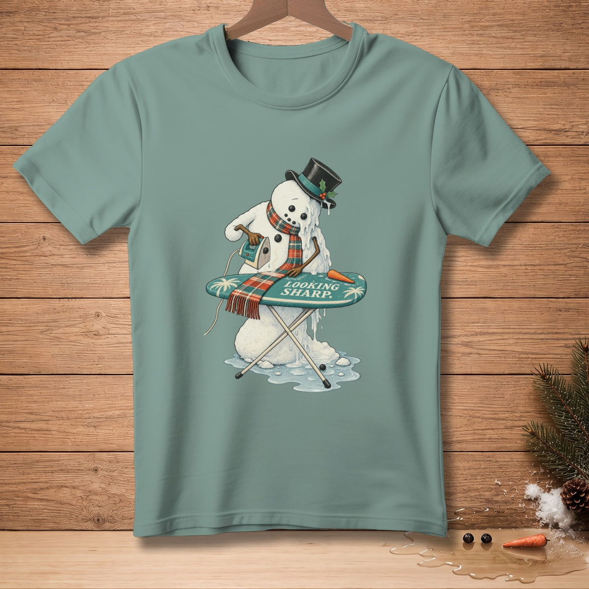 Melting snowman ironing an ironing board with text "LOOKING SHARP."