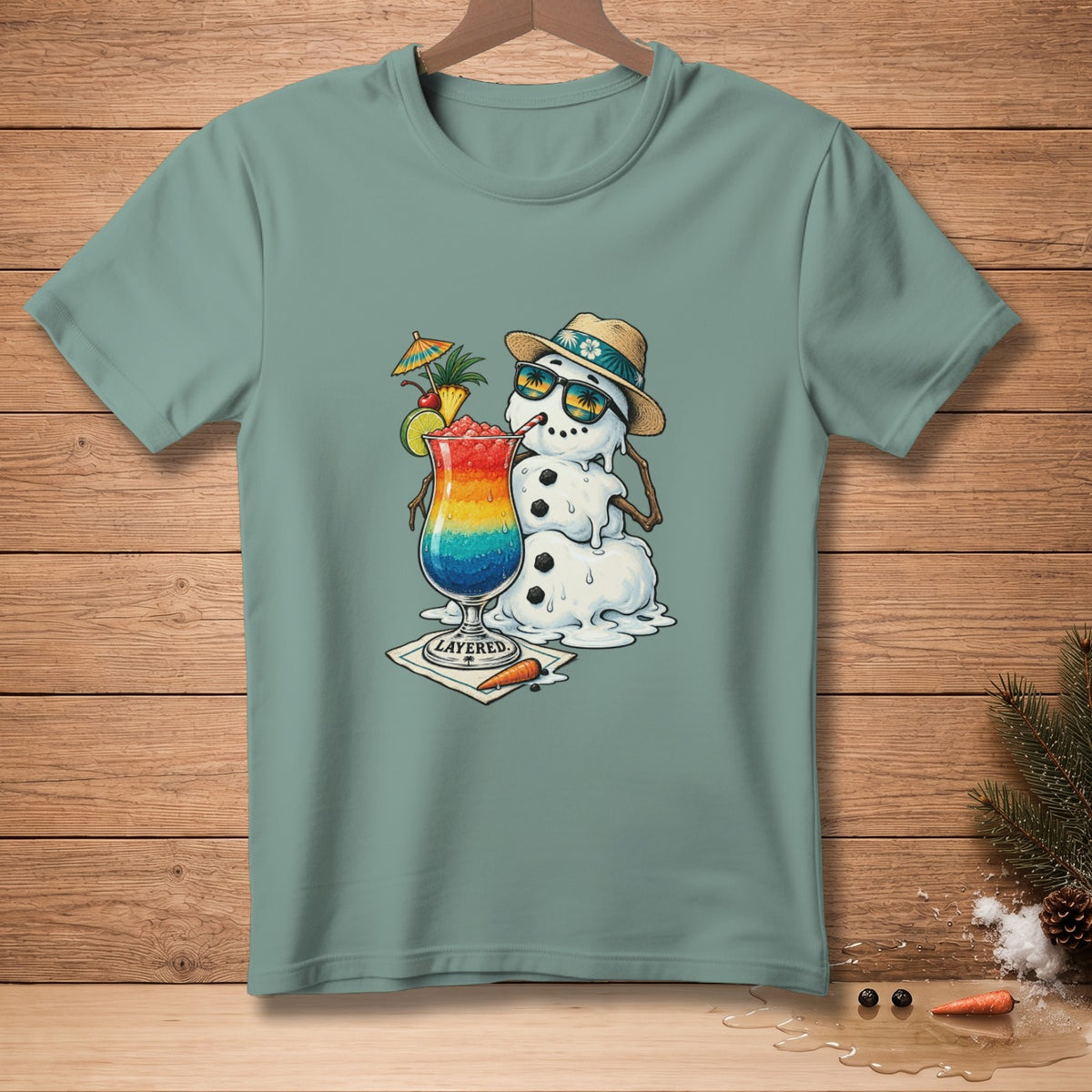 Melting snowman in sunglasses holding a rainbow layered cocktail with "LAYERED" text.