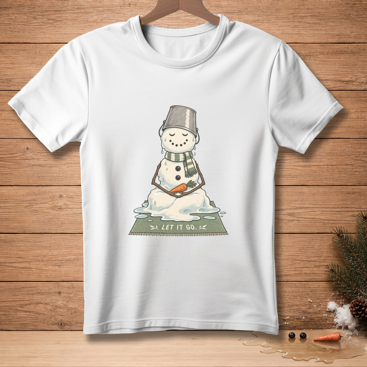 White t-shirt with melting snowman graphic saying "LET IT GO."