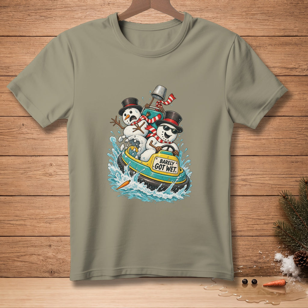 Three snowmen in a boat with "Barely Got Wet" text on a light green t-shirt.