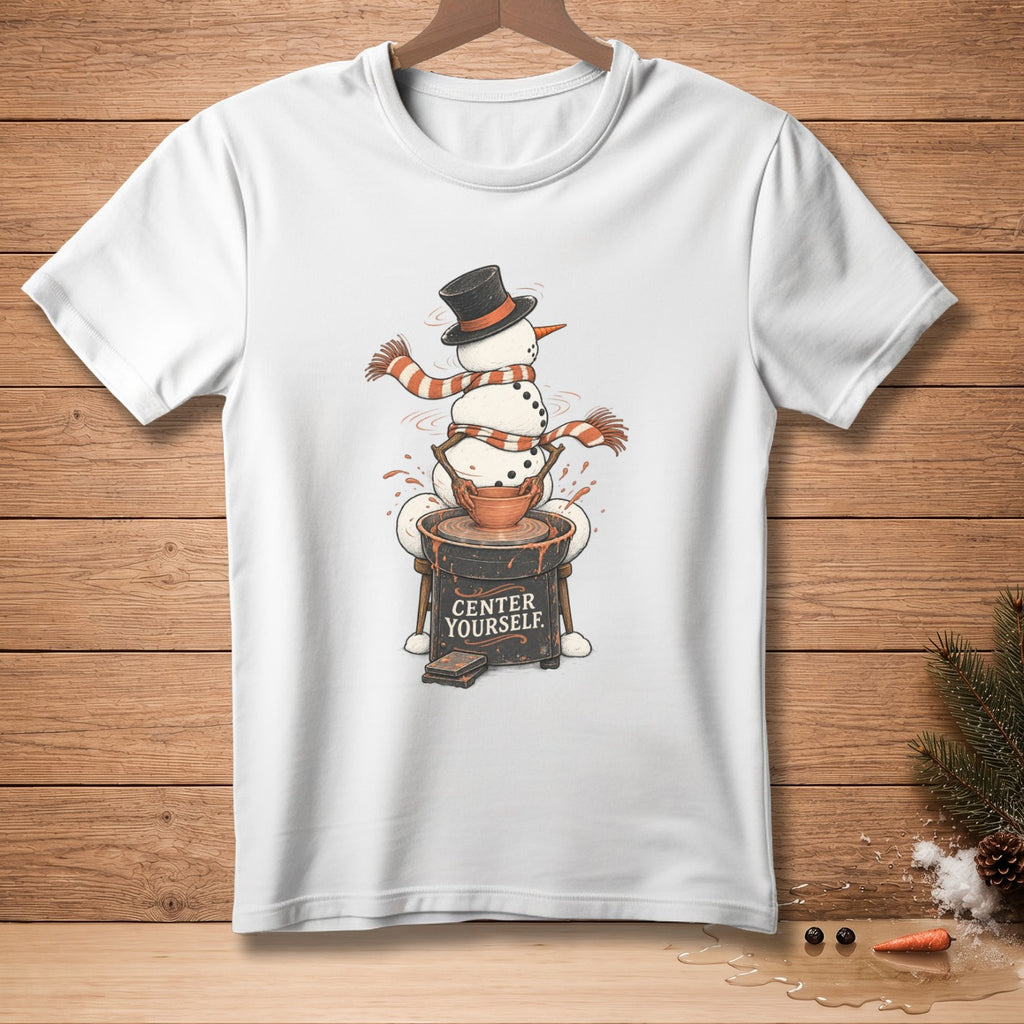 White t-shirt with snowman making pottery, text "CENTER YOURSELF".