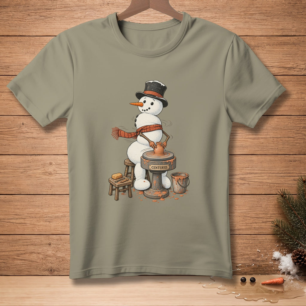 Snowman using a pottery wheel, wearing a top hat and scarf. Text reads "CENTERED."