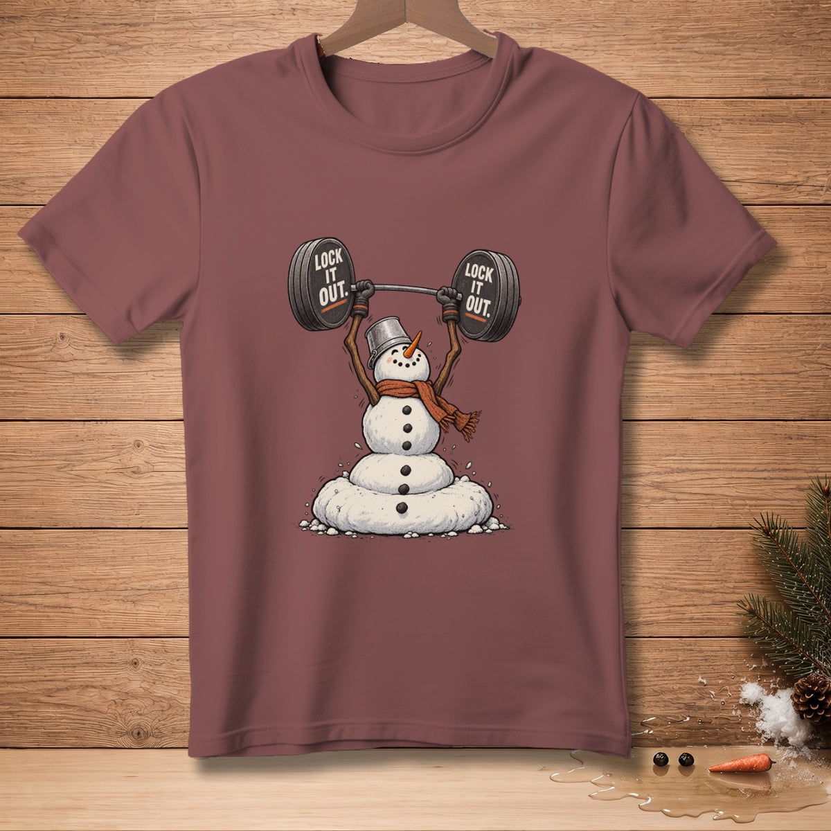 Snowman wearing a hat and scarf lifting a barbell with "LOCK IT OUT" text.