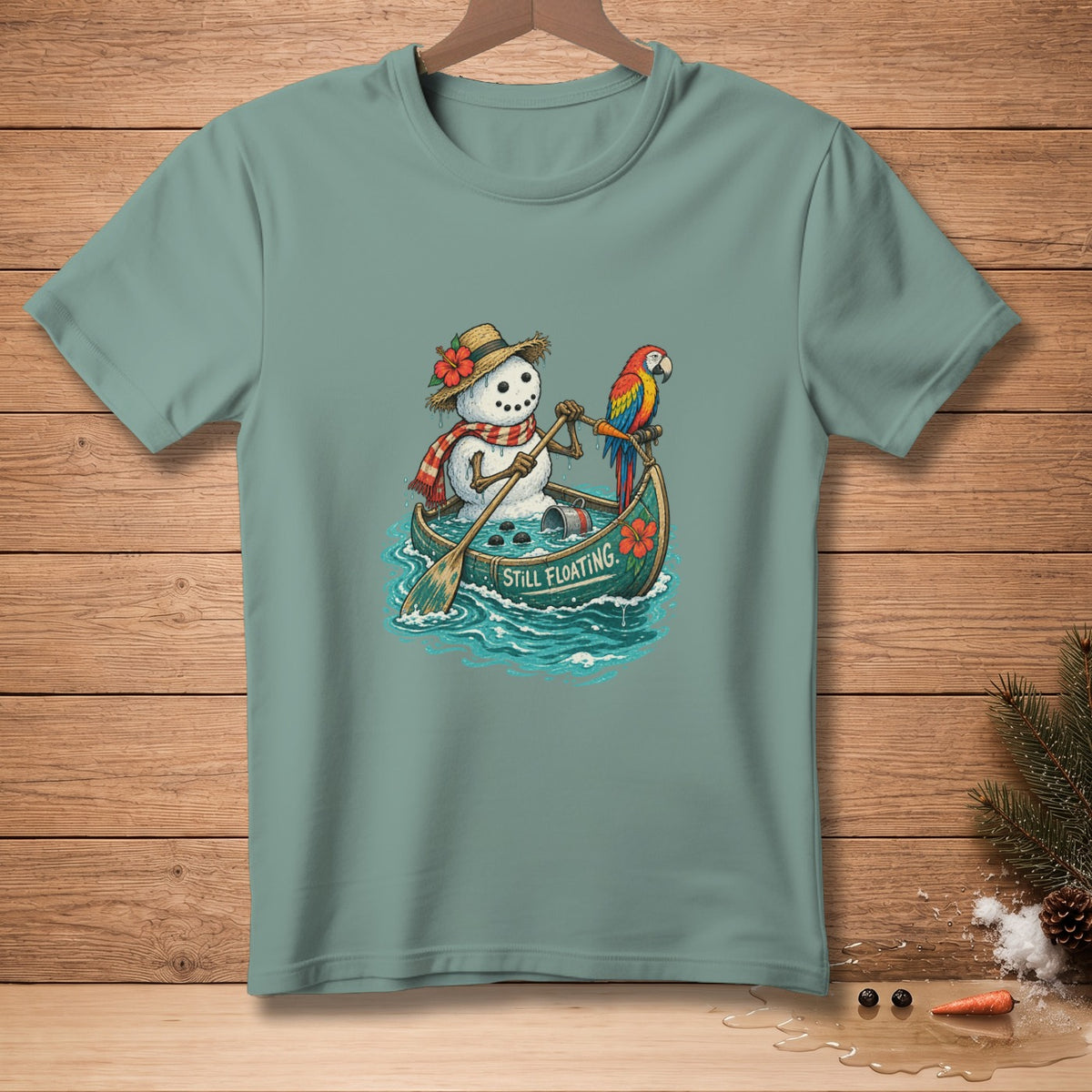Snowman in a canoe with a parrot, paddle, and text "STILL FLOATING."