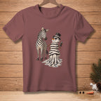 Zebra and melting snowman with spray can on maroon t-shirt.