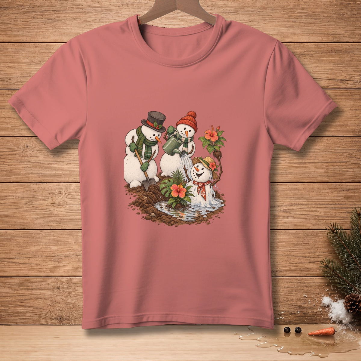 T-shirt with a graphic of snowmen watering plants and digging in the dirt.