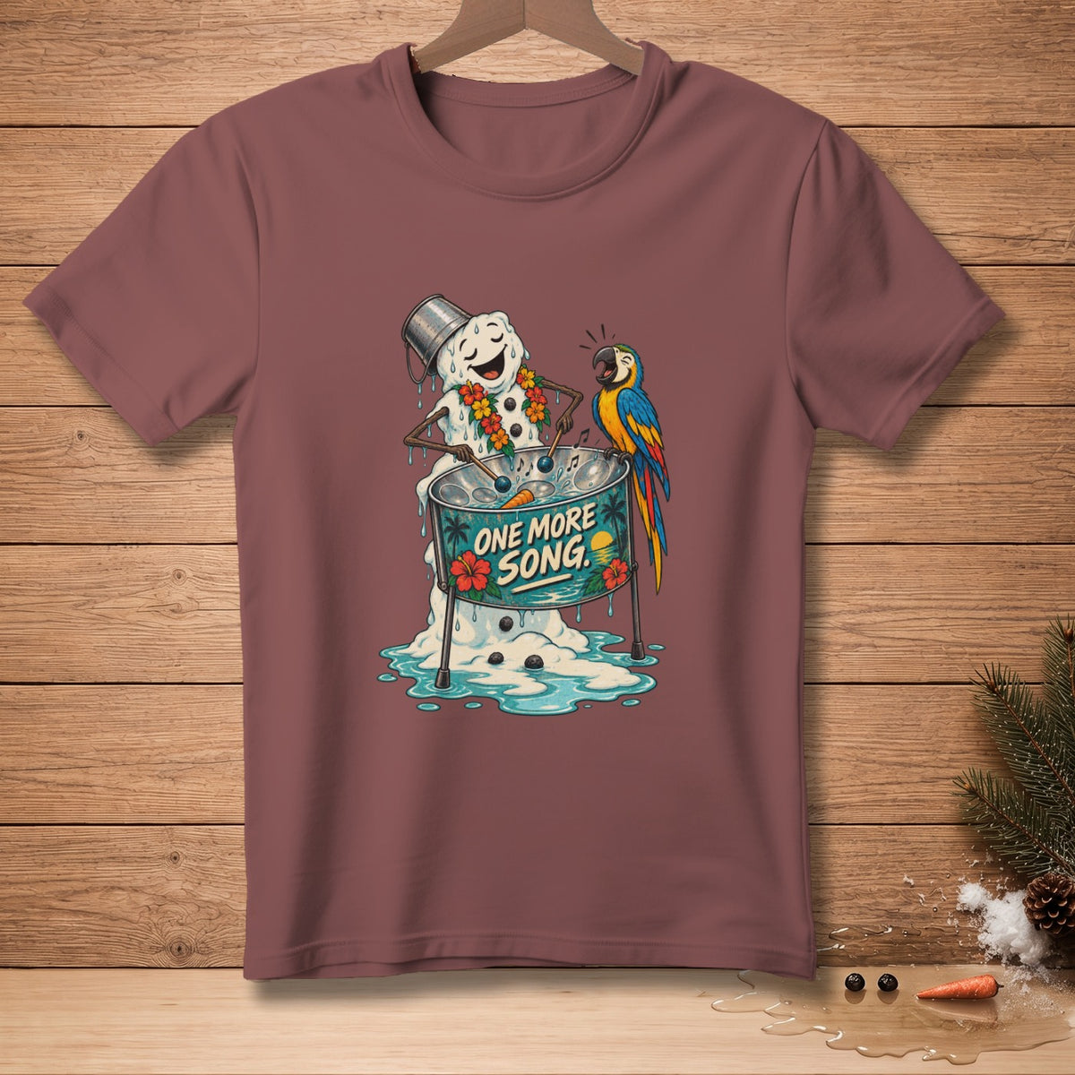 Snowman with lei playing steel drum with parrot, reads "ONE MORE SONG".