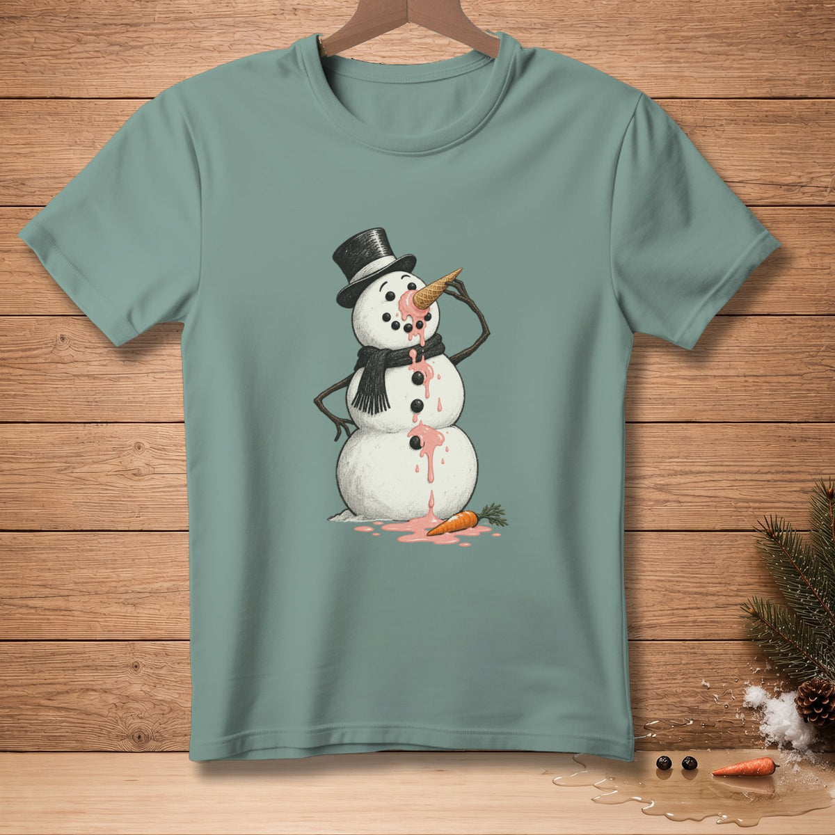 Melting snowman with an ice cream cone nose on a teal t-shirt.
