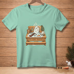 Snowman in a sauna with "FIVE MORE MINUTES" text on a turquoise t-shirt.