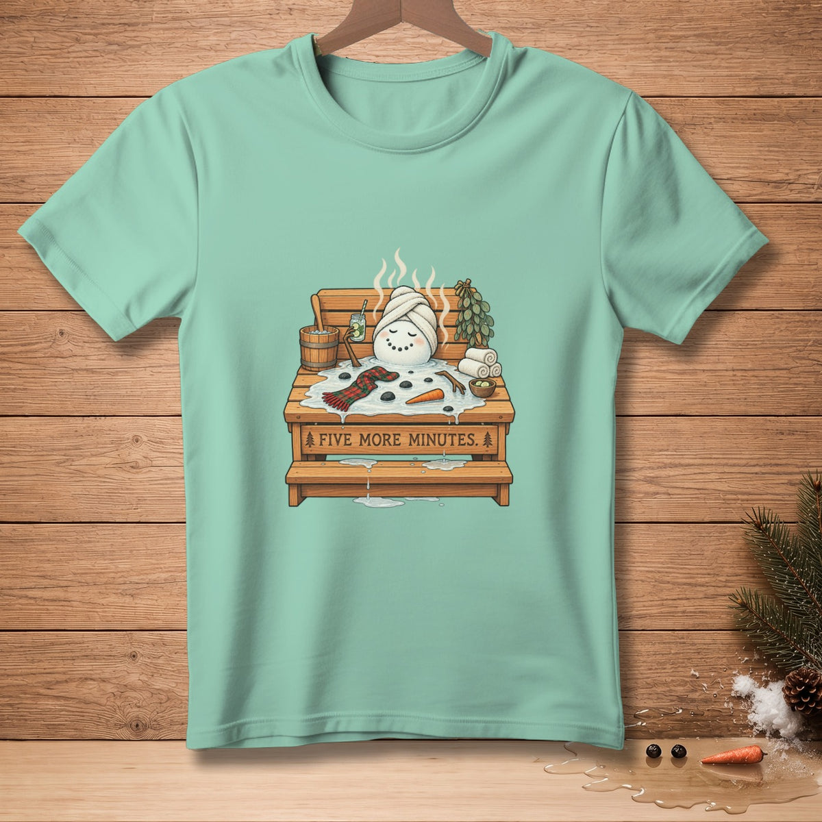 Snowman in a sauna with "FIVE MORE MINUTES" text on a turquoise t-shirt.