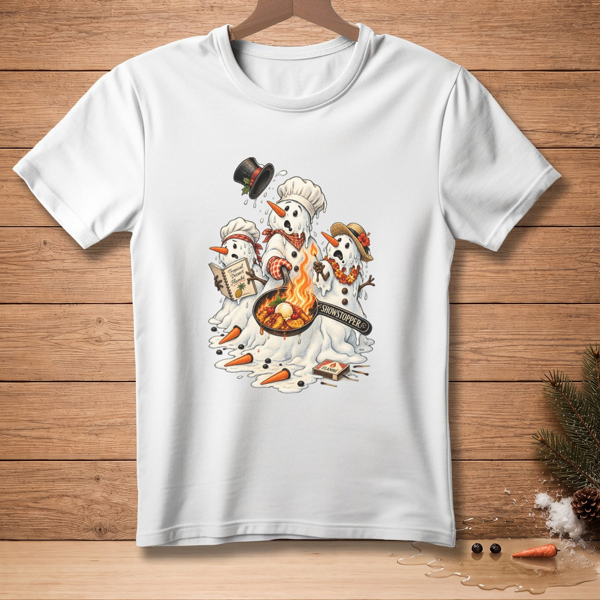 Melting snowmen cooking flambe with "Showstopper" text and dessert recipe book.