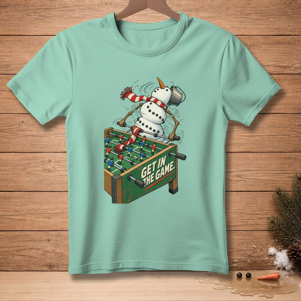 Snowman playing foosball with text "GET IN THE GAME."