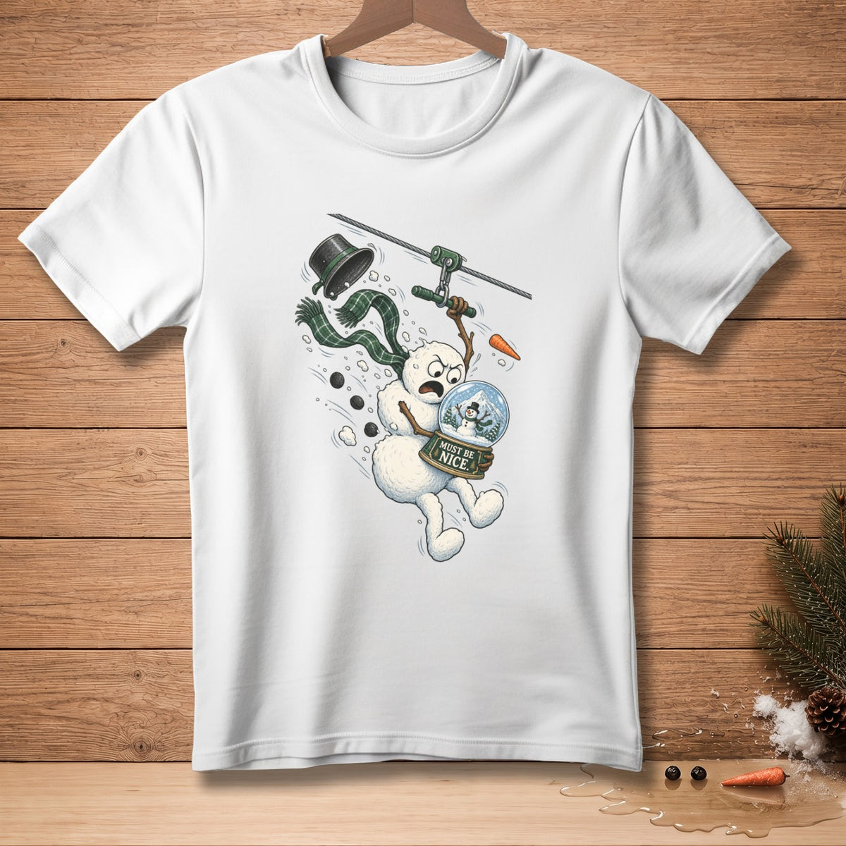 Snowman on zipline holding snow globe with text "Must Be Nice".