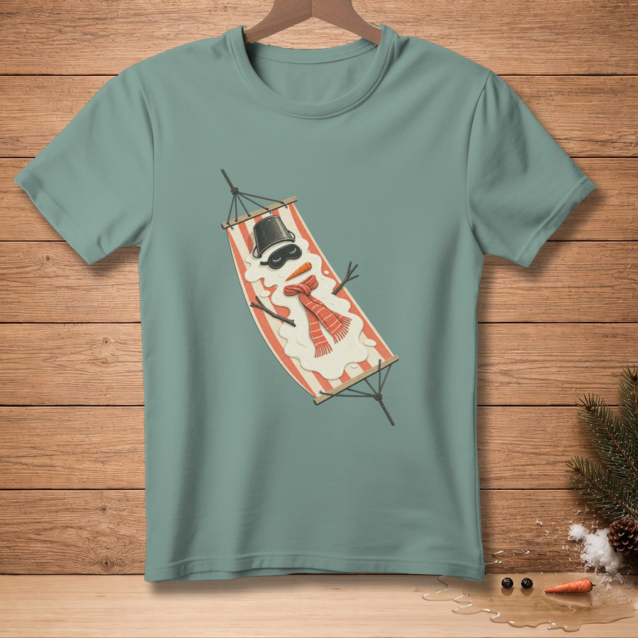 T-shirt with a melting snowman wearing a hat, scarf, and eye mask relaxing in a hammock.