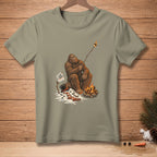 Bigfoot roasts a marshmallow over a campfire, holding a sign that says "I like it crispy."