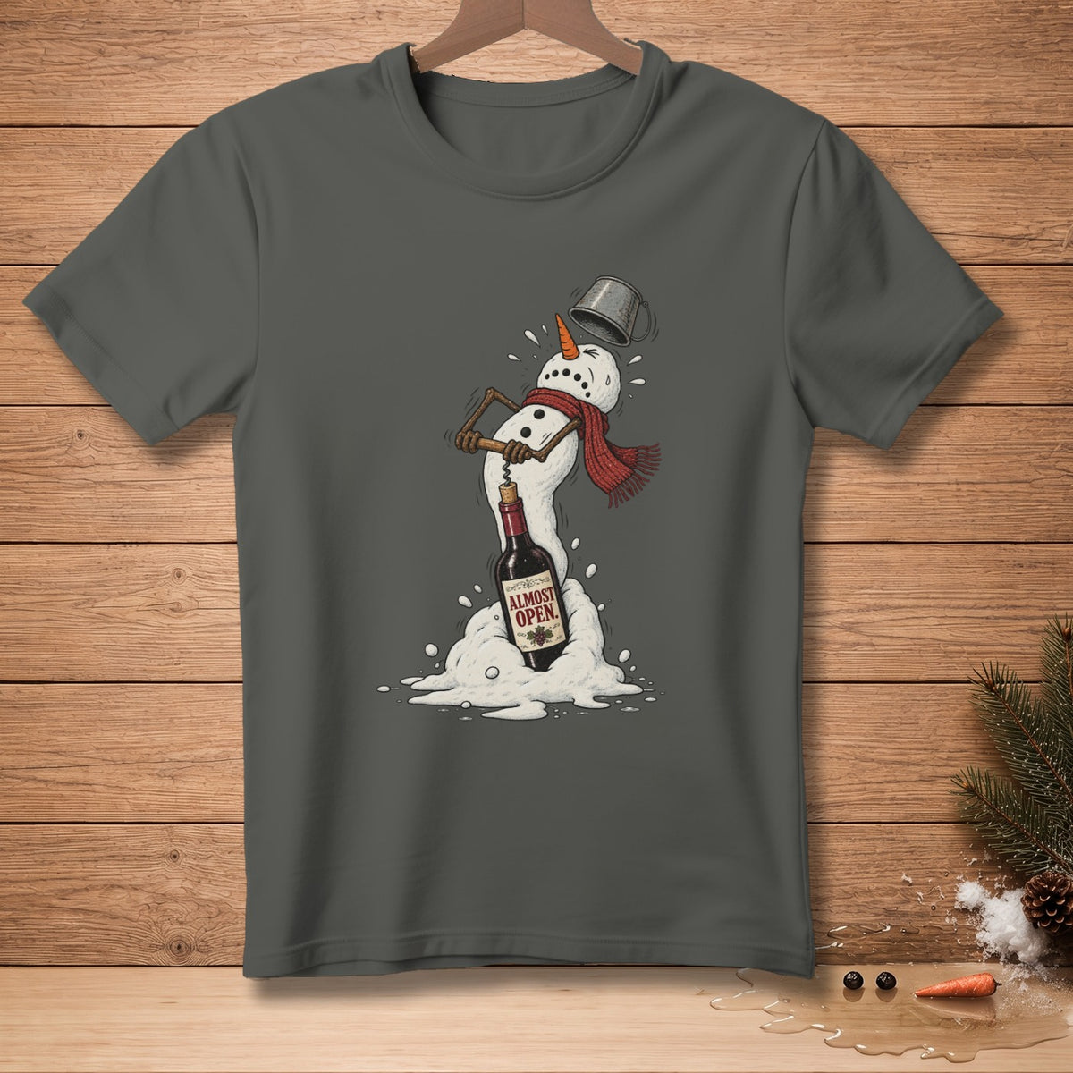 T-shirt with melting snowman struggling to open wine bottle, text "ALMOST OPEN".