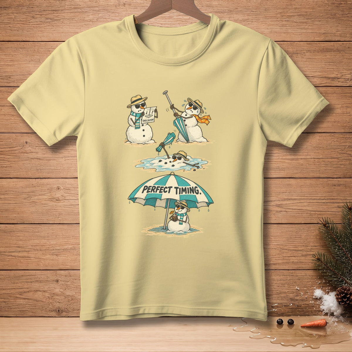 T-shirt graphic of snowmen melting under a beach umbrella with "Perfect Timing" text.
